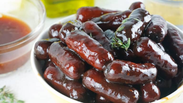 Smoked little smokies in a serving bowl.