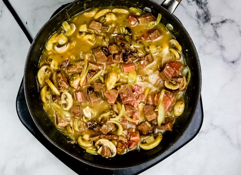 beef added to the skillet and all is heating.