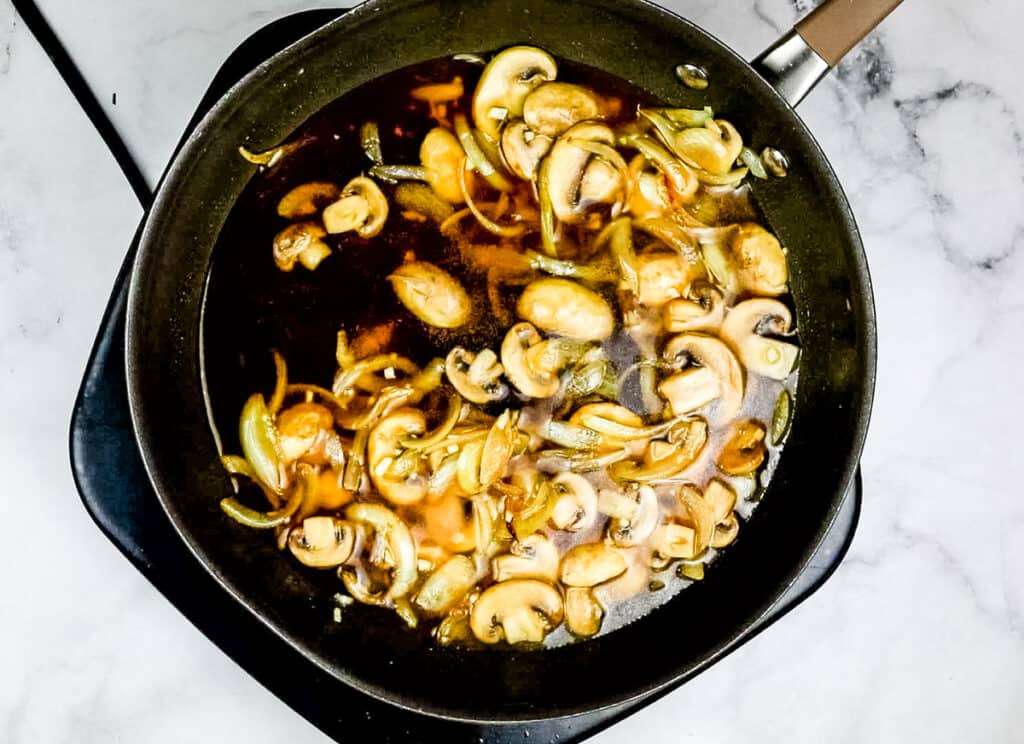 Broth added to the skillet to make leftover roast beef stroganoff.