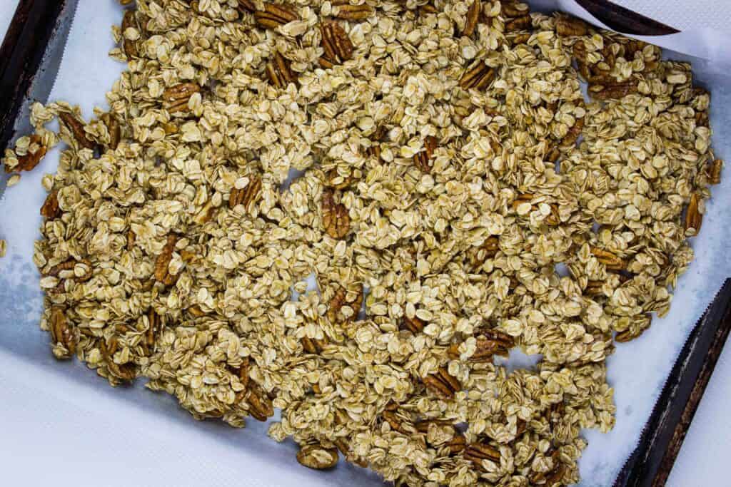 Spread the maple pecan granola over a parchment paper lined baking sheet.