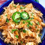 a closeup of chicken tinga instant pot in a serving dish