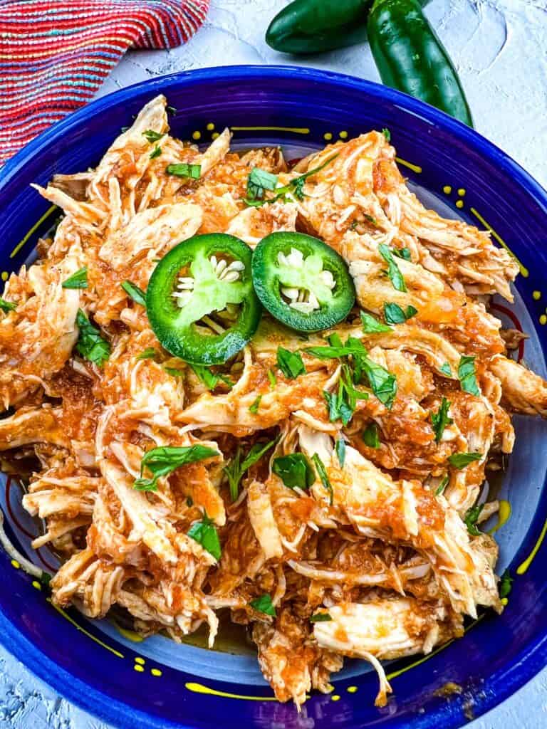 a closeup of chicken tinga instant pot in a serving dish
