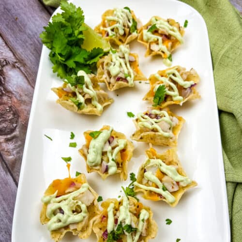 chicken tortilla cups on a white platter