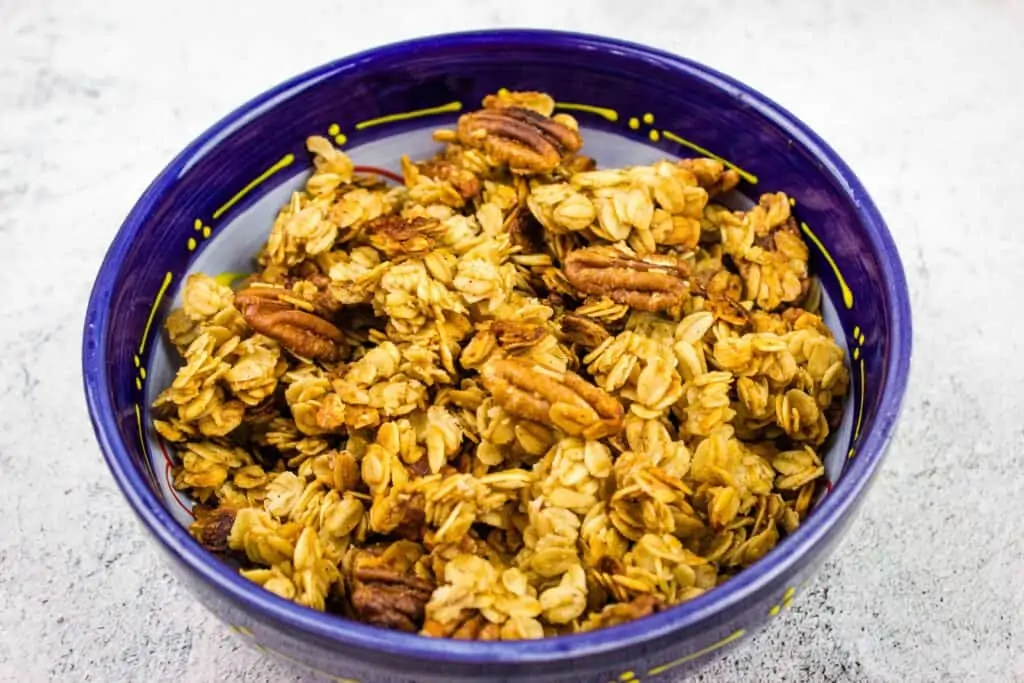 maple pecan granola in a blue bowl