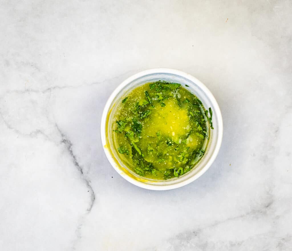 Mix butter, dijon, garlic powder, and parsley