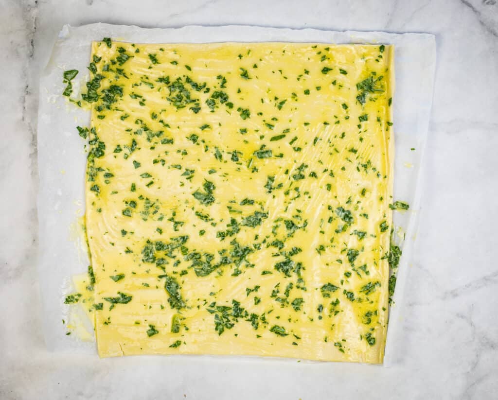 layer on butter mixture to make prosciutto puff pastry pinwheels
