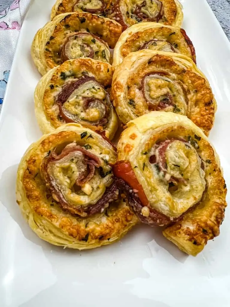 prosciutto and parmesan pinwheels on a platter