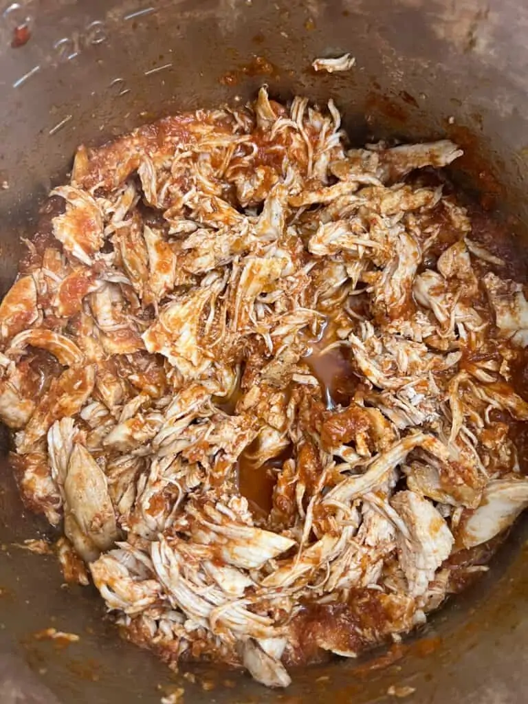 shred the chicken and return to the instant pot to heat through