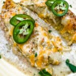 A closeup of smoked chicken enchiladas.