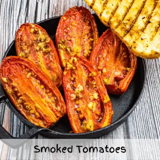 smoked tomatoes on a plate with grilled bread on the side