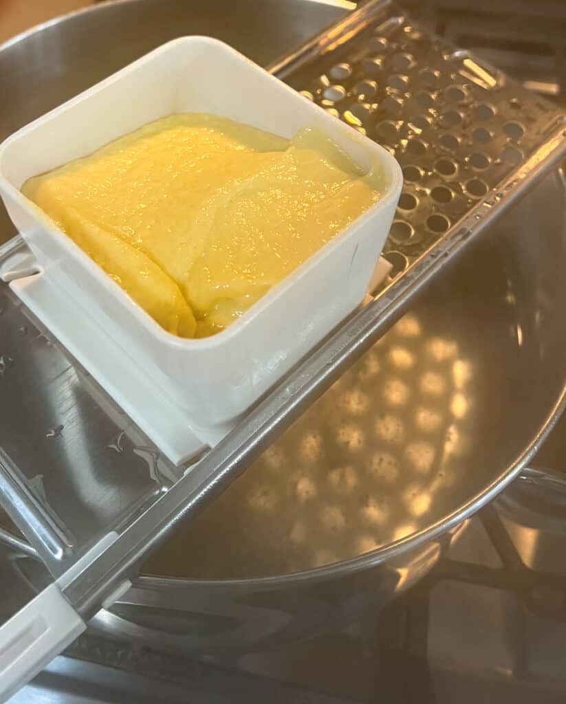 Load the hopper with spaetzle batter.