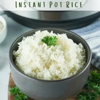  A bowl of cooked rice with an Instant Pot in the background.