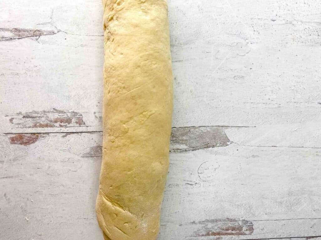 The apple pie cinnamon rolls rolled up like a jelly roll.