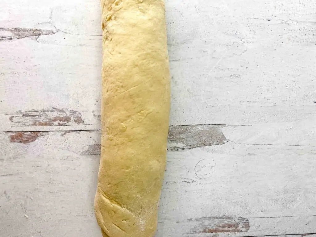 The apple pie cinnamon rolls rolled up like a jelly roll.