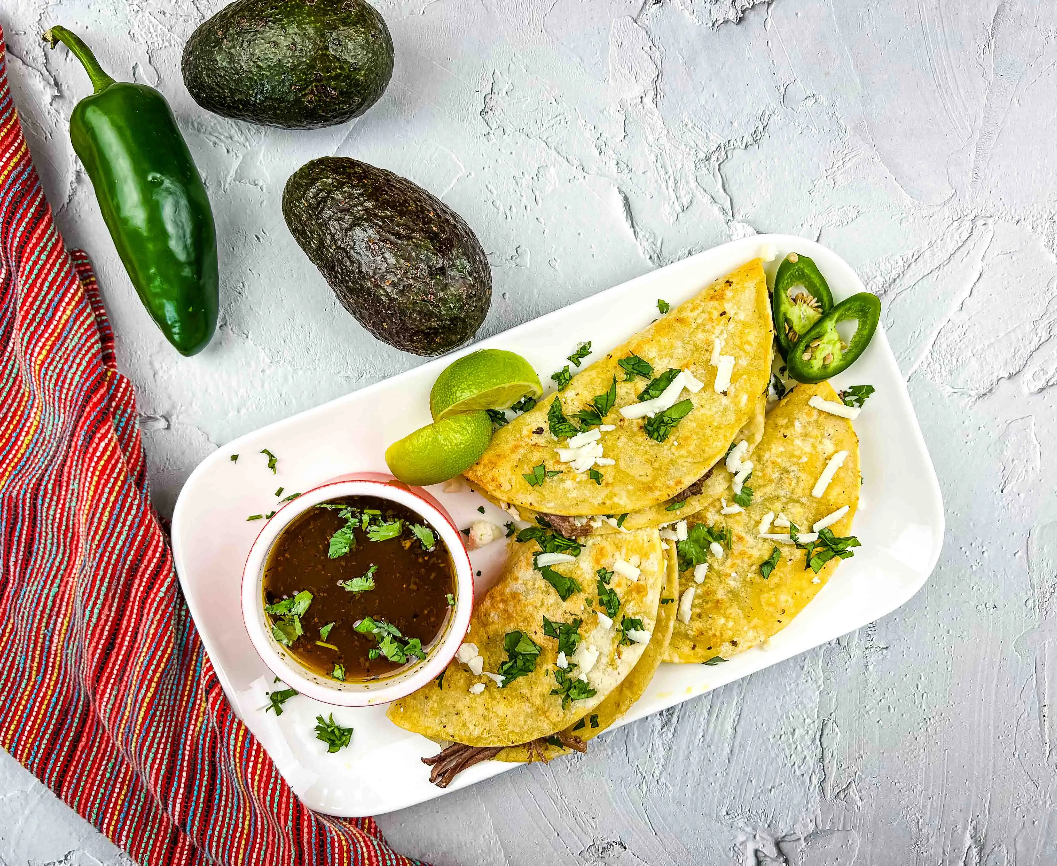 Serve and enjoy your birria tacos.