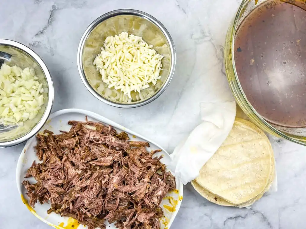 Birria taco ingredients ready for assembly.