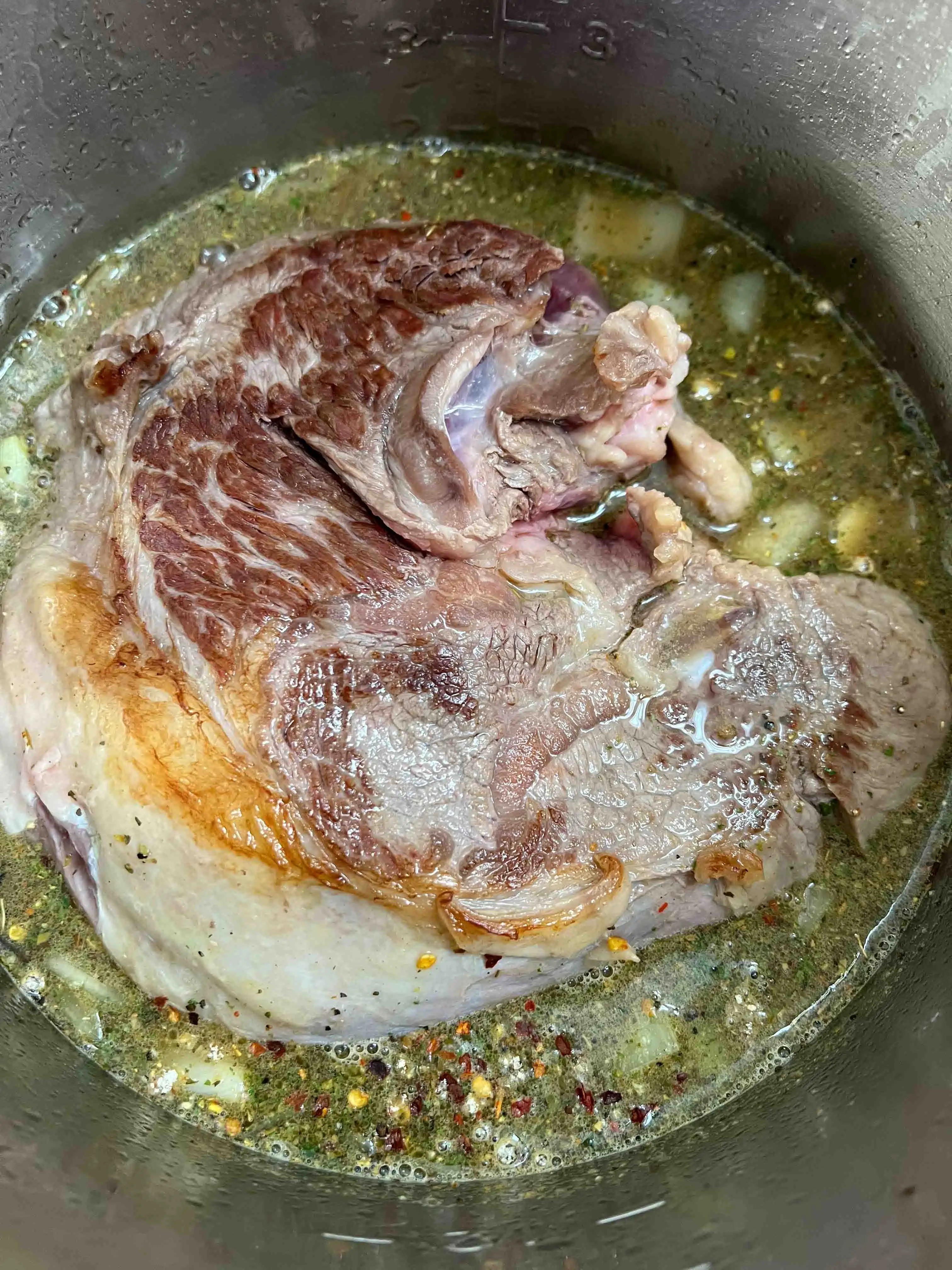 adding the beef back to the instant pot to make italian beef sandwiches