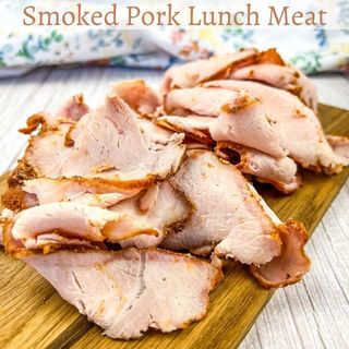 Smoked Pork Lunch Meat on a cutting board.