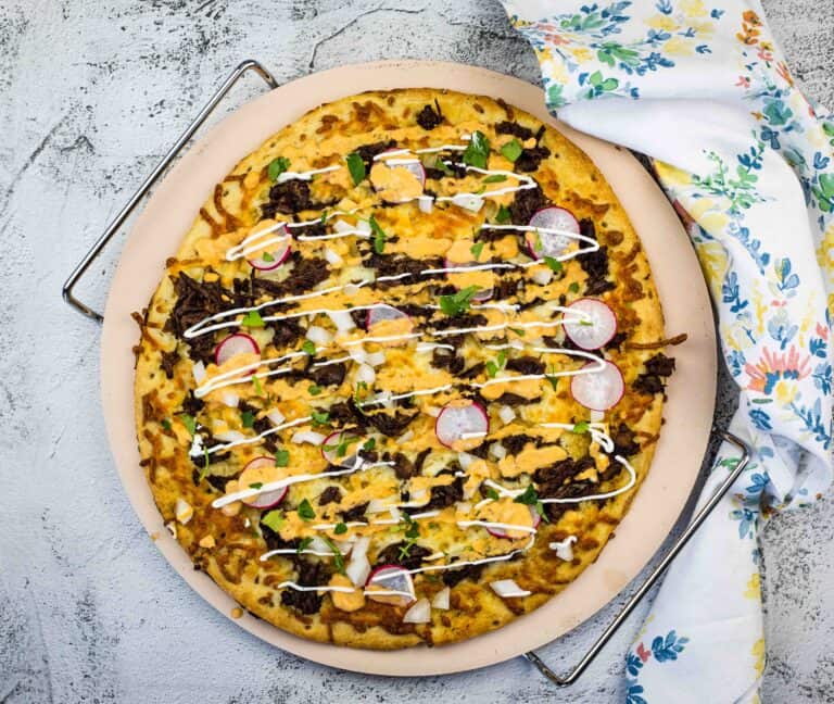 Birria Pizza on a pizza stone