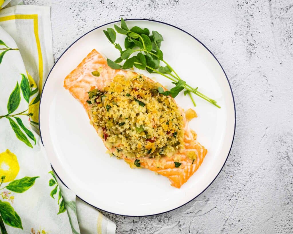 Cooked Seafood Stuffed Salmon on a plate.