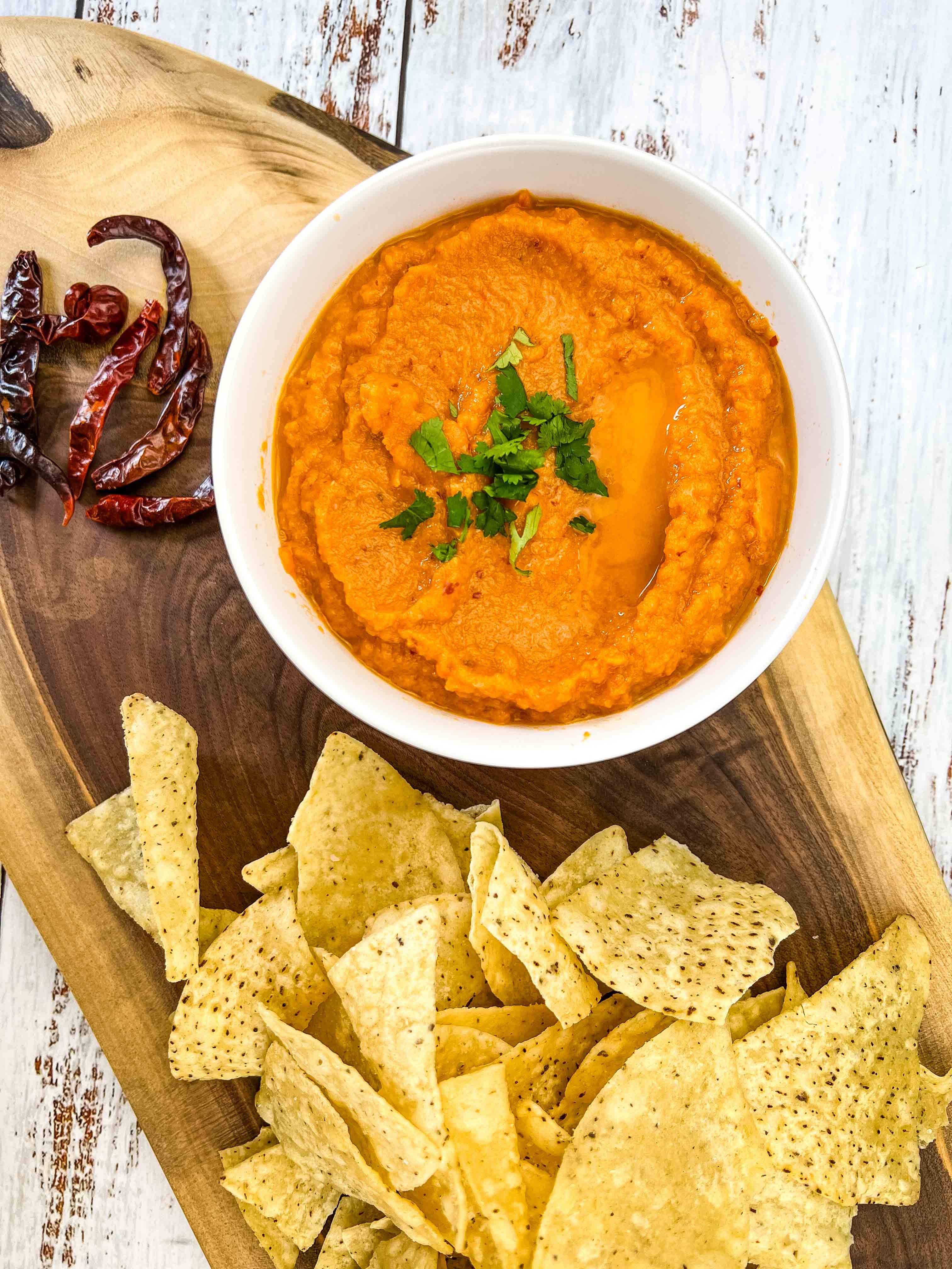 chile de arbol salsa on a platter with chips
