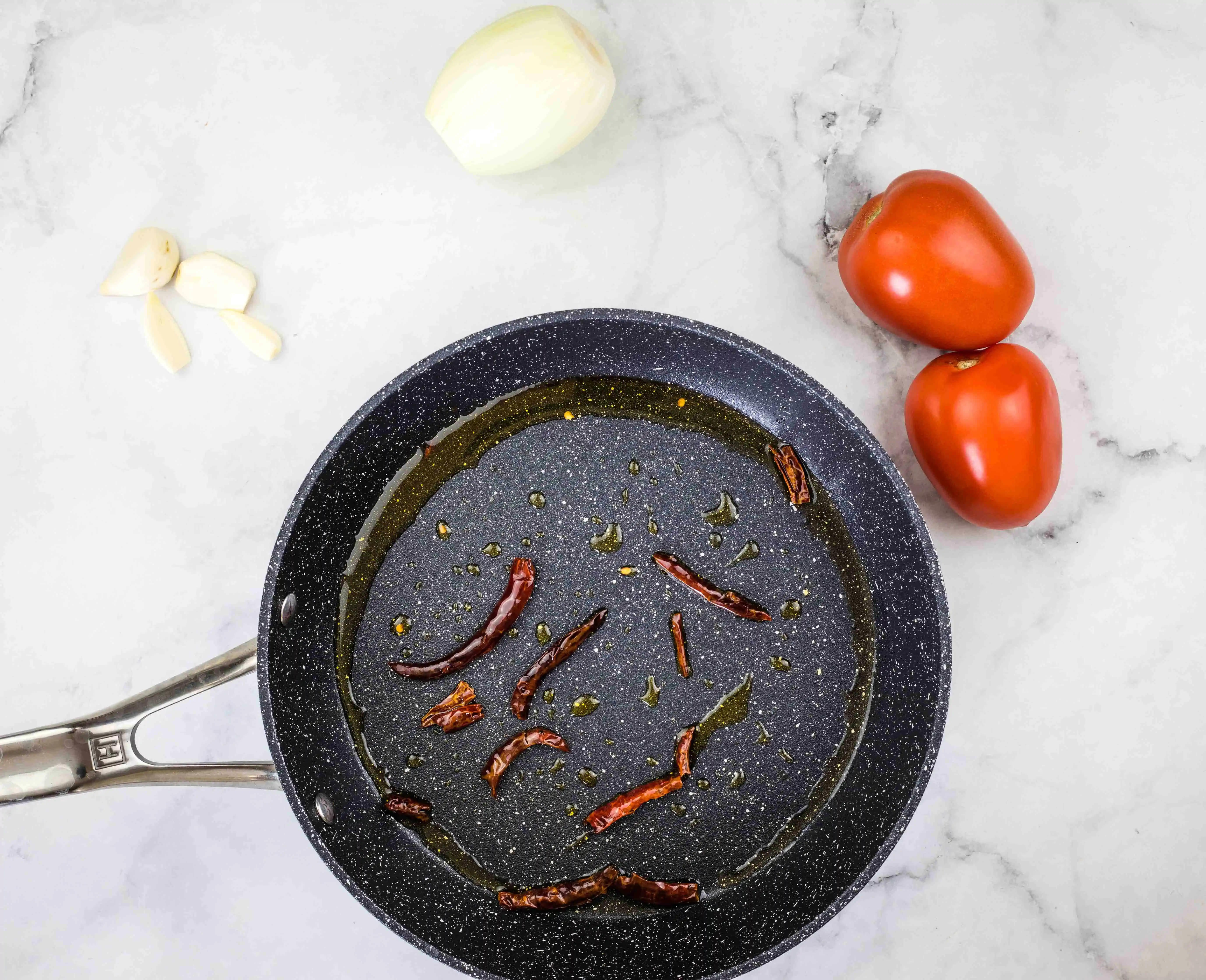 toasting the chilis in oil