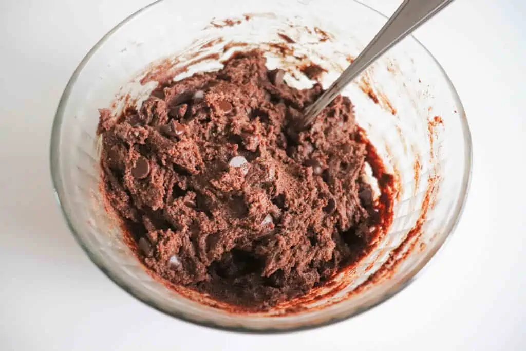 Mixed cookie dough in a bowl.