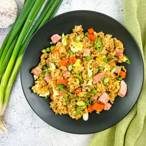 ham fried rice on a black plate