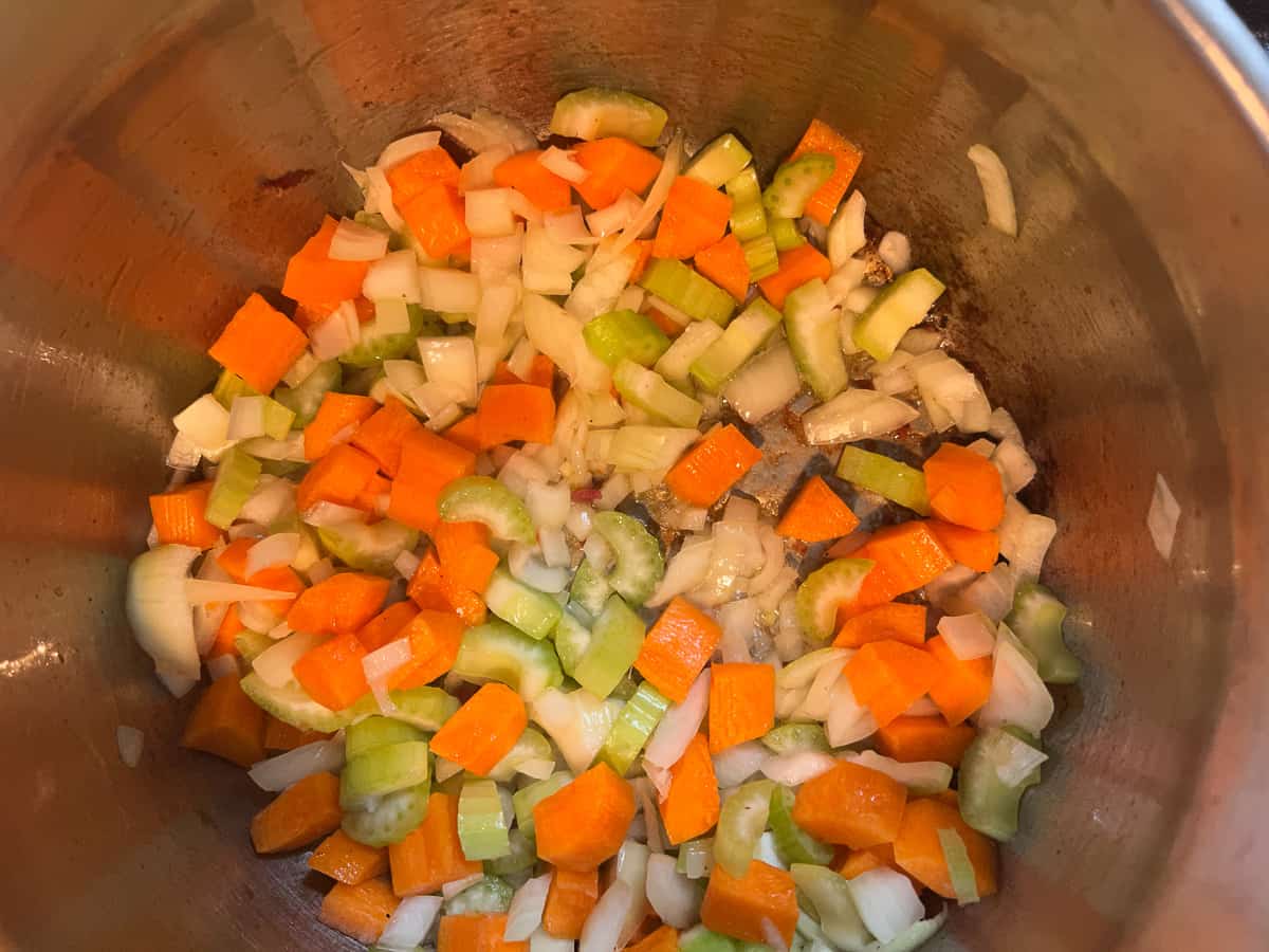 sauting the veggies in the soup pot in bacon fat and butter