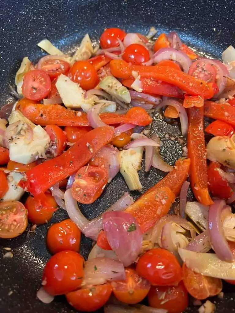 sauteing vegetables in a skillet