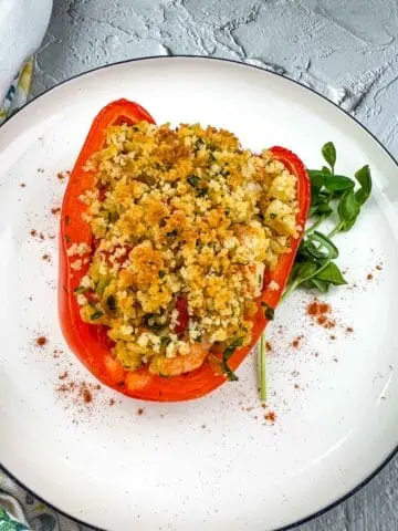 Seafood stuffed bell pepper on a plate