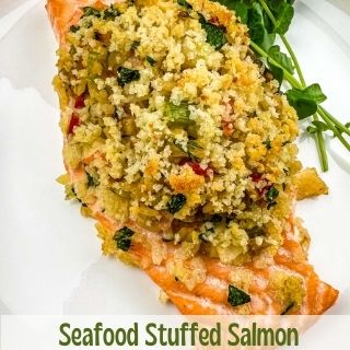 seafood stuffed salmon on a plate