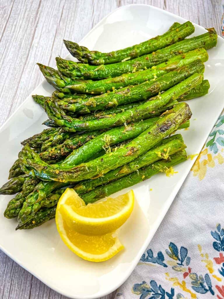 griddled asparagus on a white platter