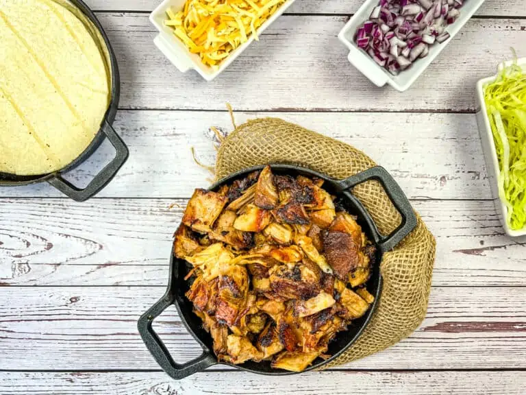 Instant precision Dutch oven Carnitas on a cast iron skillet with Taco Fixings