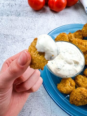 air fryer popcorn chicken with dipping sauce on it