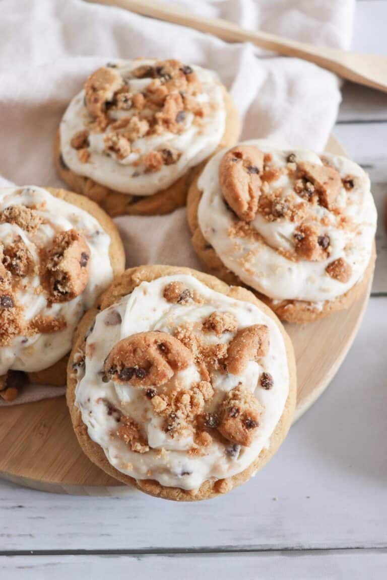 cookie dough frosted chocolate chip cookies on a plate