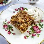 a closeup of a maple pecan pie bar on a saucer