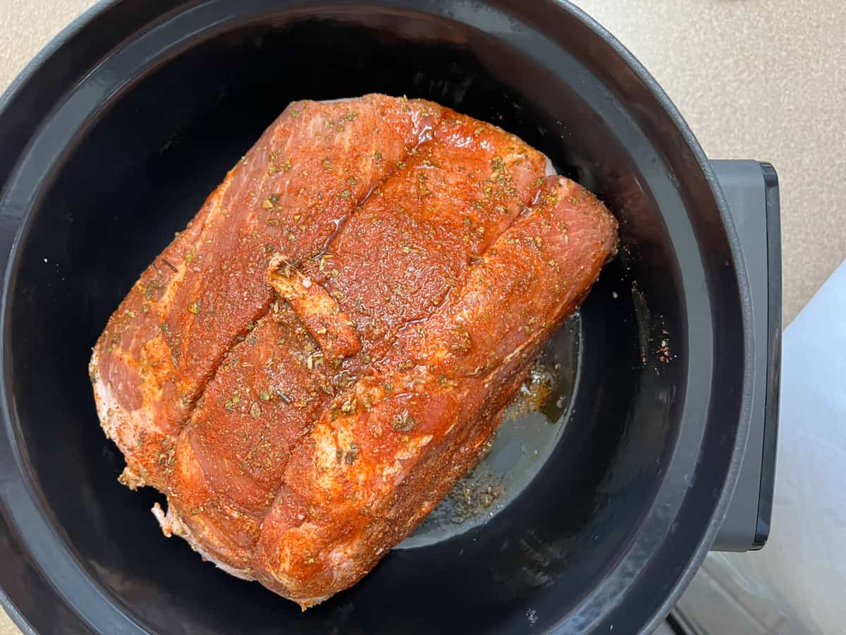 searing the pork in the dutch oven