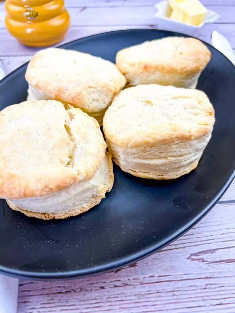 flaky smoked biscuits on a black plate