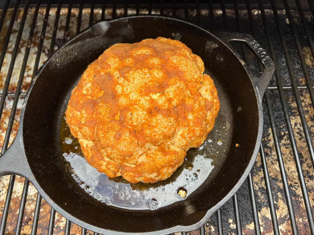 Spice-rubbed smoked cauliflower on the smoker.
