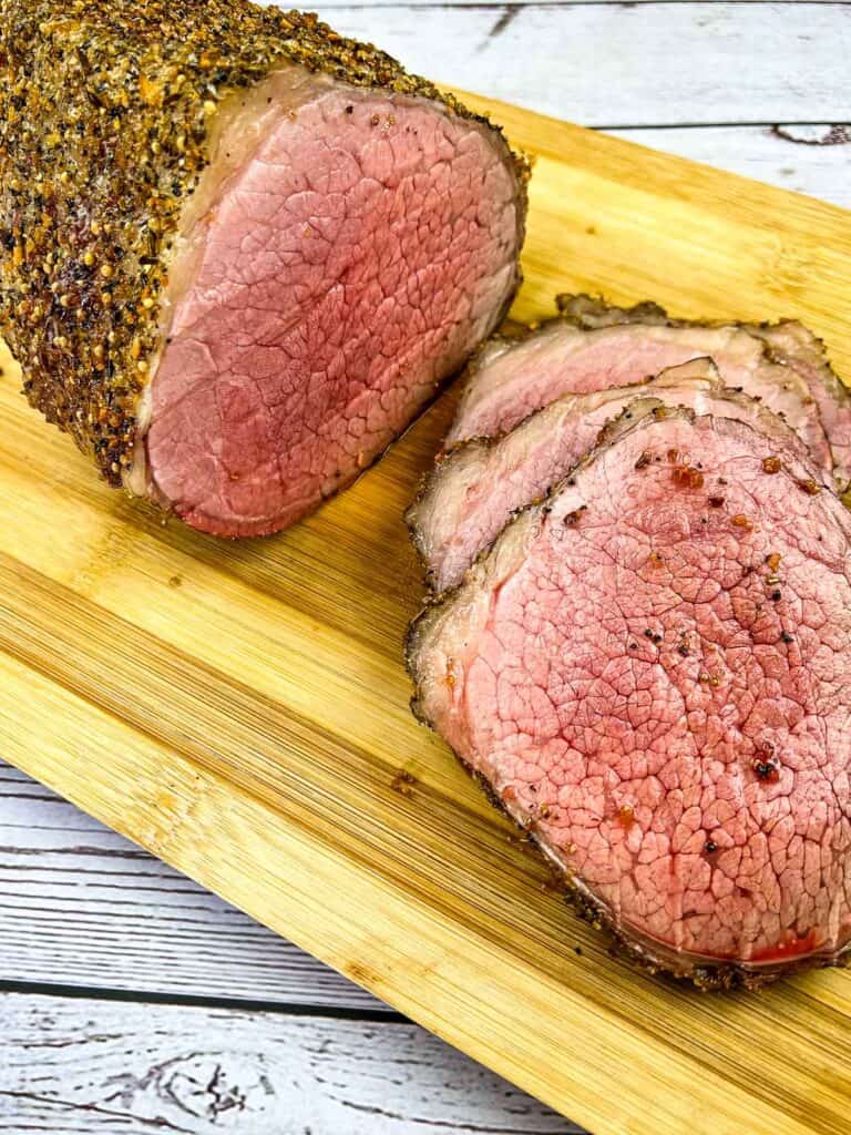 sliced smoked eye of round on a cutting board