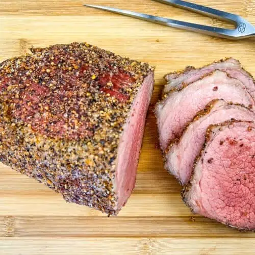 smoked eye of round roast on a cutting board