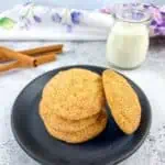 pumpkin snickerdoodle cookies on a plate with milk in a glass