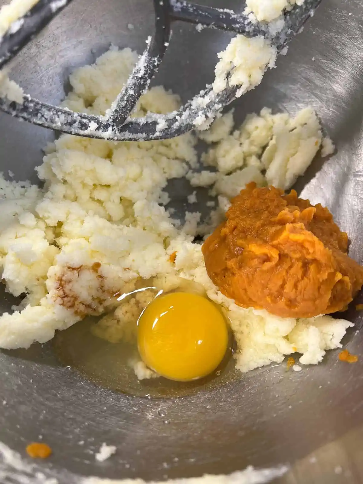 egg and pumpkin added to dough