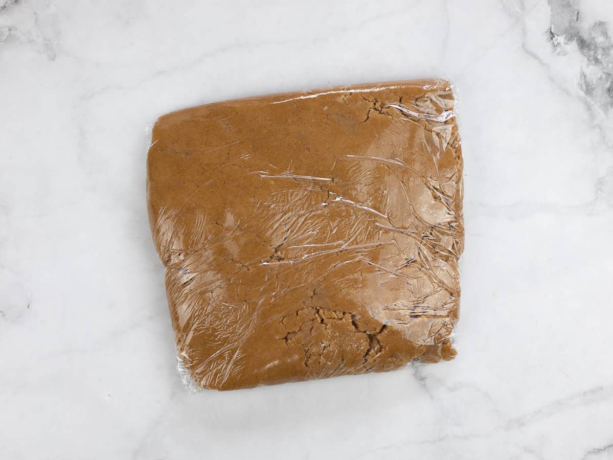 Plastic wrapped dough disc.