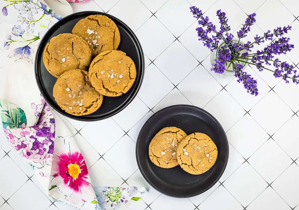 salted caramel brown butter snickerdoodle cookies on black plates