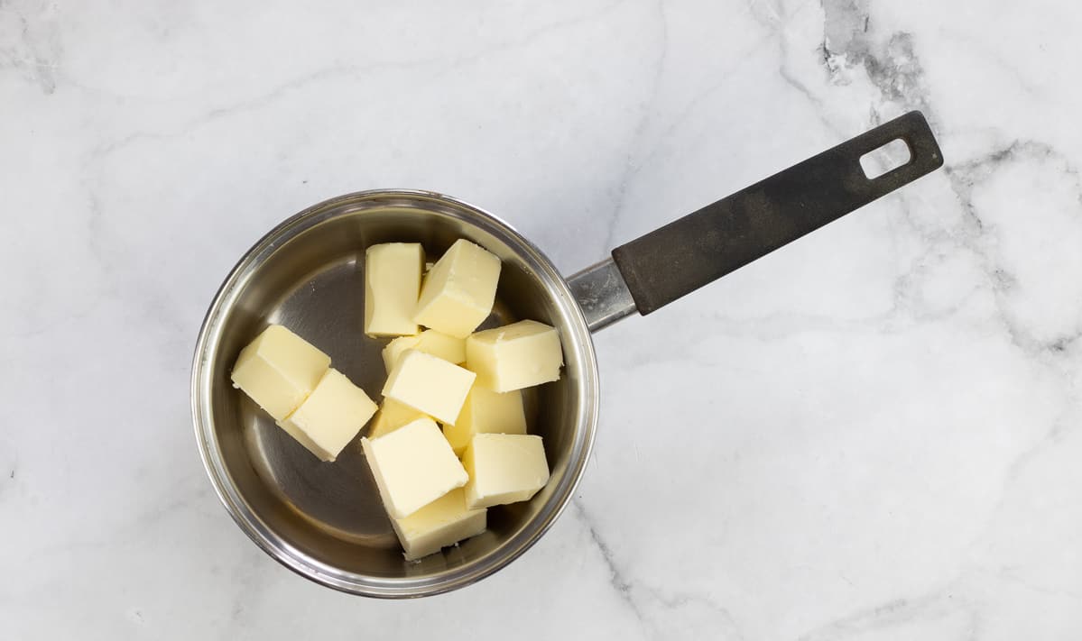 Melting the butter in a small saucepan.