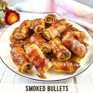 Smoked Bullets on a white plate.