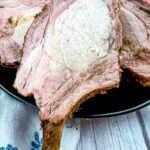 smoked rack of pork cut on a plate