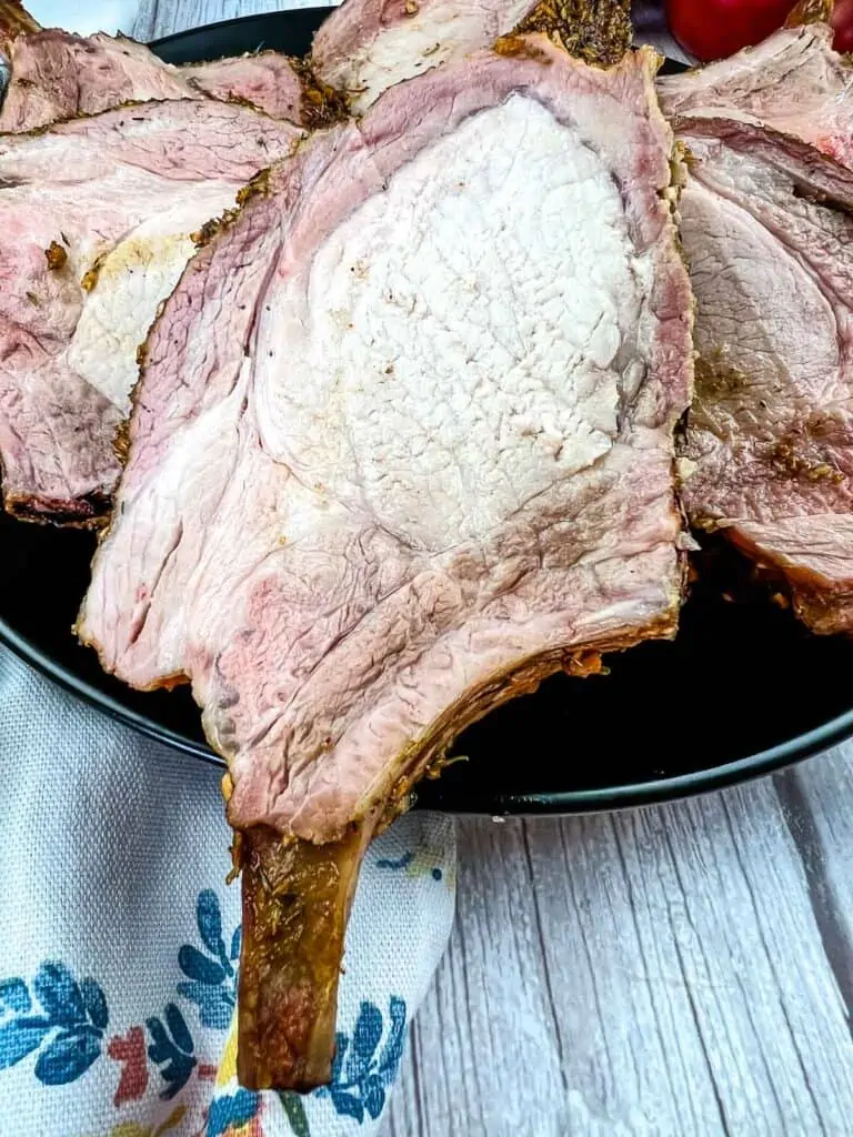 smoked rack of pork cut on a plate